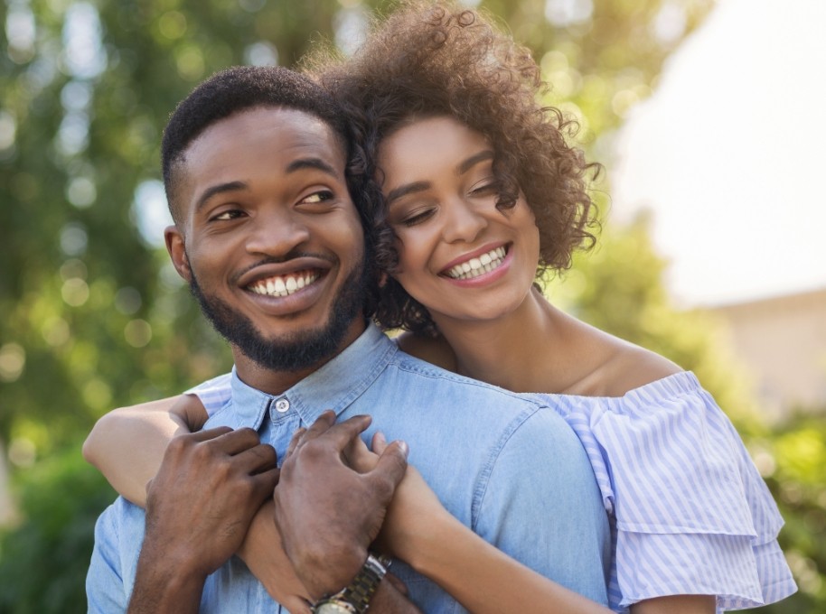 Woman and man outdoors after Nu Smile Aligner treatment