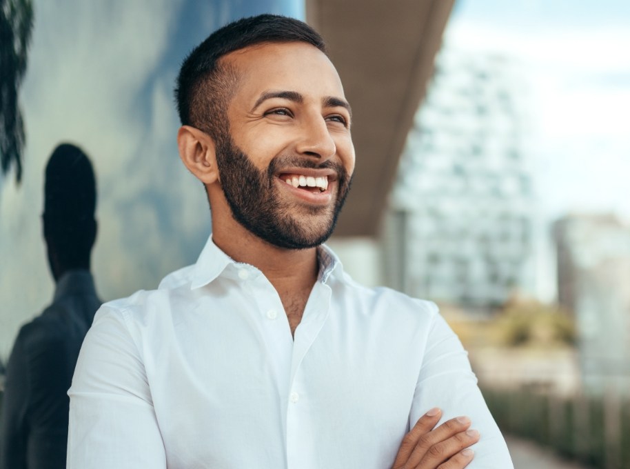 Man with attractive smile after Nu Smile Aligner treatment