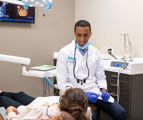 Doctor G conducting a Nu Smile Aligner quality check with patient