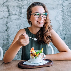 a woman in Eatontown eating a healthy meal