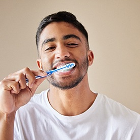 a man in Eatontown brushing his teeth 