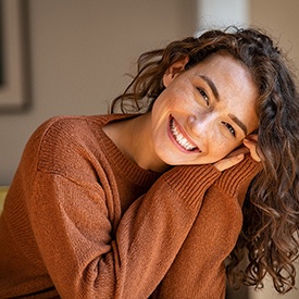 a woman in Eatontown smiling after undergoing Invisalign 