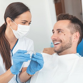dentist and patient discussing the cost of alternative Invisalign treatment in Staten Island 