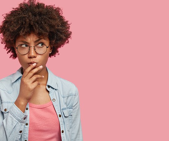 Woman on pink background wondering about Invisalign in Barnegat 