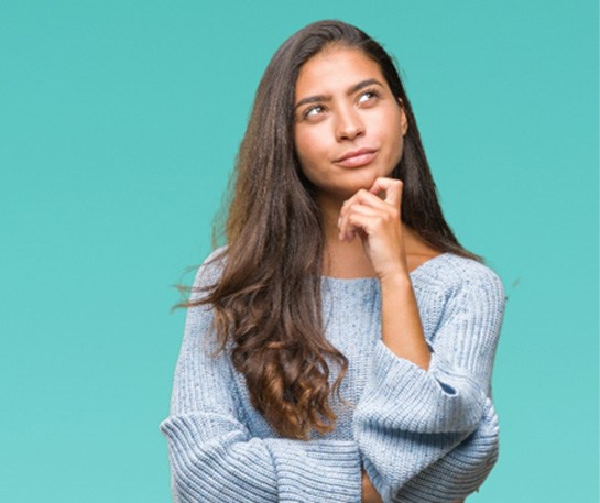 Woman wondering about Invisalign in Brick compared to Nu Smile Aligners 