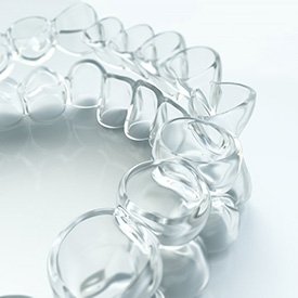 Closeup of Invisalign alternative in Staten Island on white background