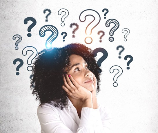 Woman on white background wondering about Invisalign in Staten Island  