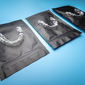 Clear aligners on black packaging