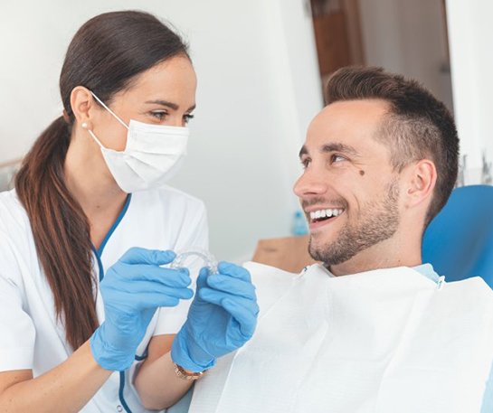 Patient and dentist discussing Invisalign in Barnegat alternatives  